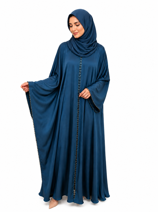 Model wearing the Amara Closed Abaya in Navy Blue featuring elegant contrast trim and a flowing modest silhouette by Simply Zida.