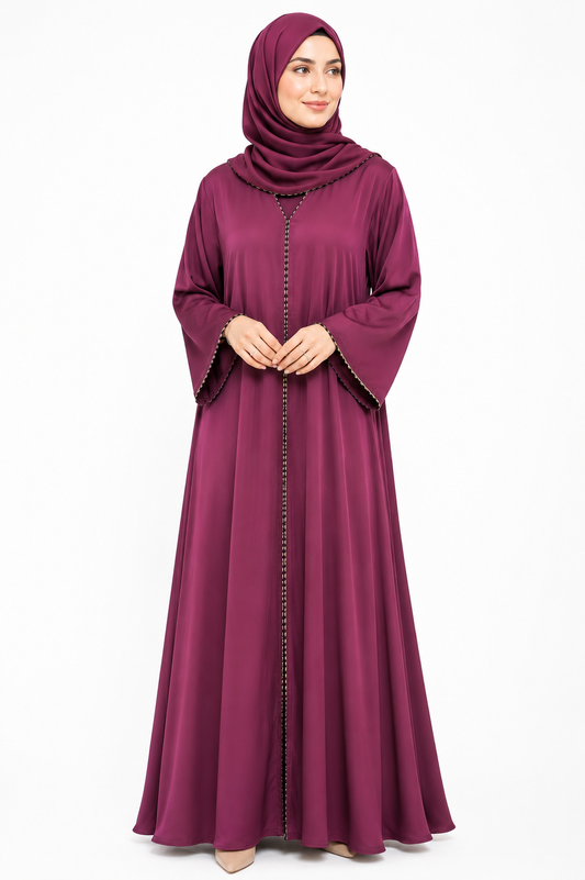 Model wearing the Amara Closed Abaya in Plum featuring elegant contrast trim and wide sleeves by Simply Zida.