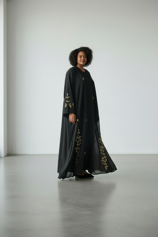 Elegant black abaya with gold crystal stone sleeve detailing side view