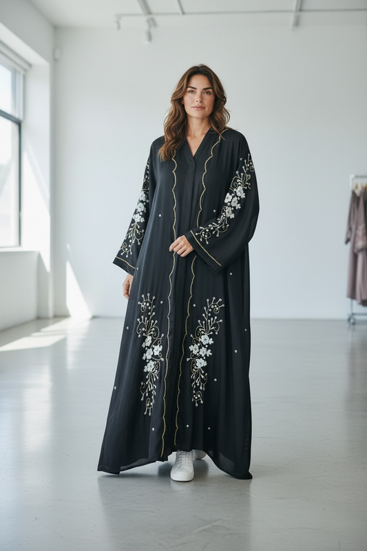 Black abaya with floral stone embellishments and gold front detailing luxury modest fashion front view
