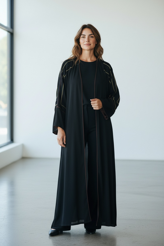 Close up of black abaya with geometric crystal stone sleeve detailing