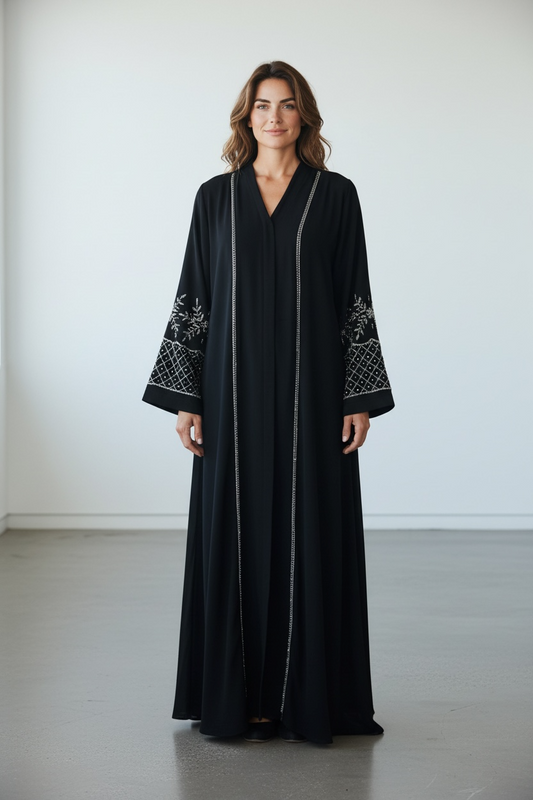 Black abaya with vertical stone embellishments and geometric stone sleeve detailing front view