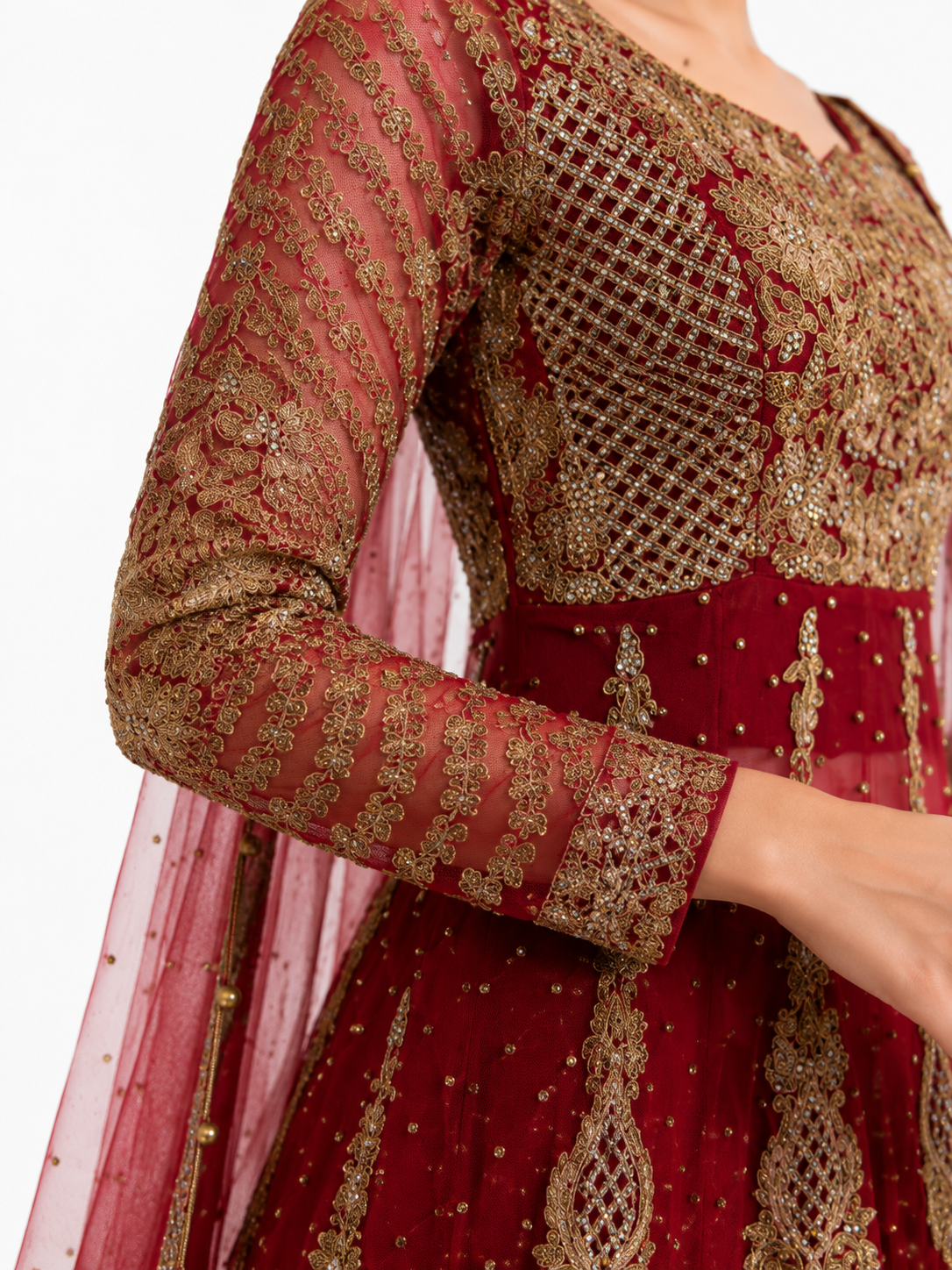 Close-up of maroon and gold Anarkali bridal dress showing intricate embroidered sleeve and bodice detailing