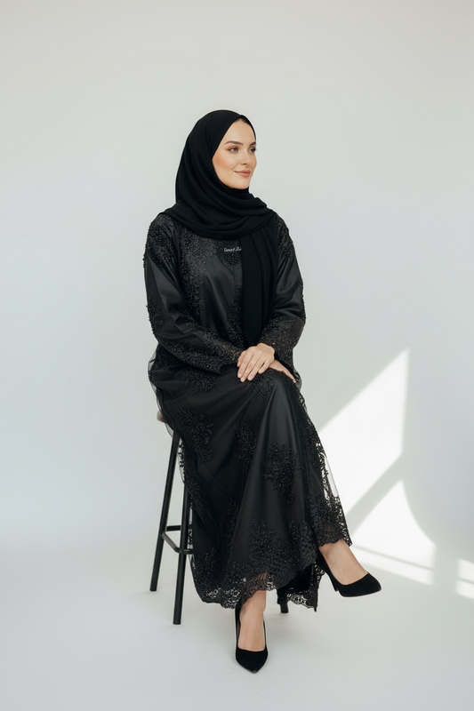 Elegant black occasion abaya with lace embroidery and subtle rhinestone sparkle