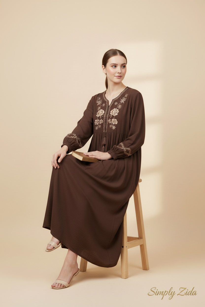 Side view of chocolate brown embroidered dress