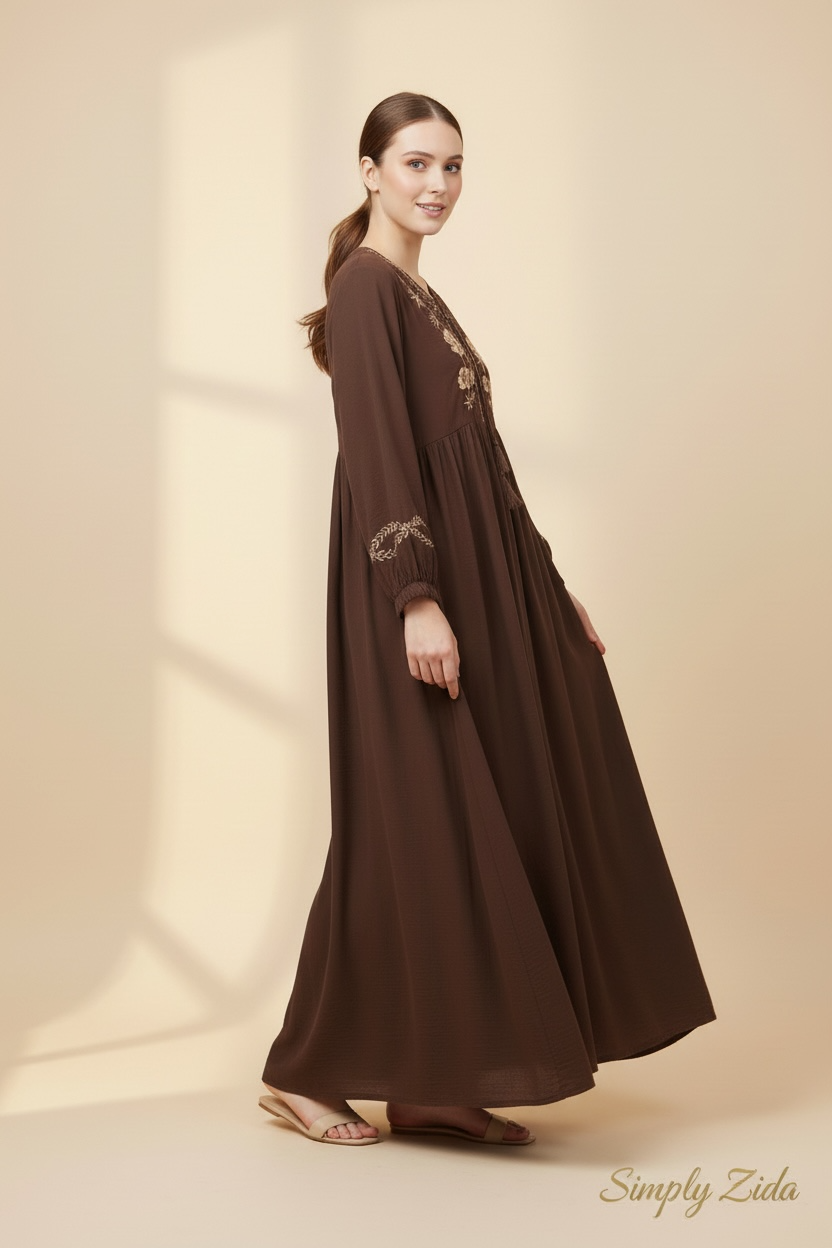 Side view of chocolate brown embroidered dress
