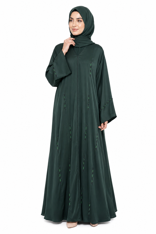 Model wearing the Serene Beaded Closed Abaya in Dark Green featuring elegant bead embellishments and a flowing modest silhouette by Simply Zida.