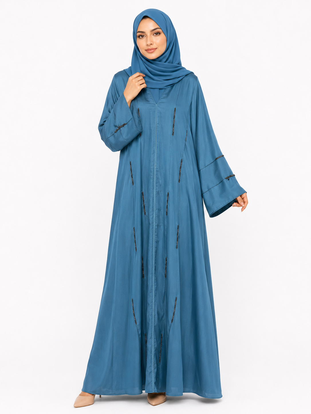 Model wearing the Serene Beaded Closed Abaya in Dusty Blue featuring elegant bead embellishments and a flowing modest silhouette by Simply Zida.