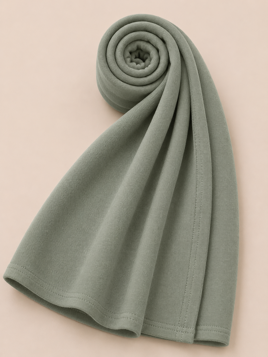 Premium dusty sage jersey hijab with soft stretch fabric and stitched edge detailing by Simply Zida
