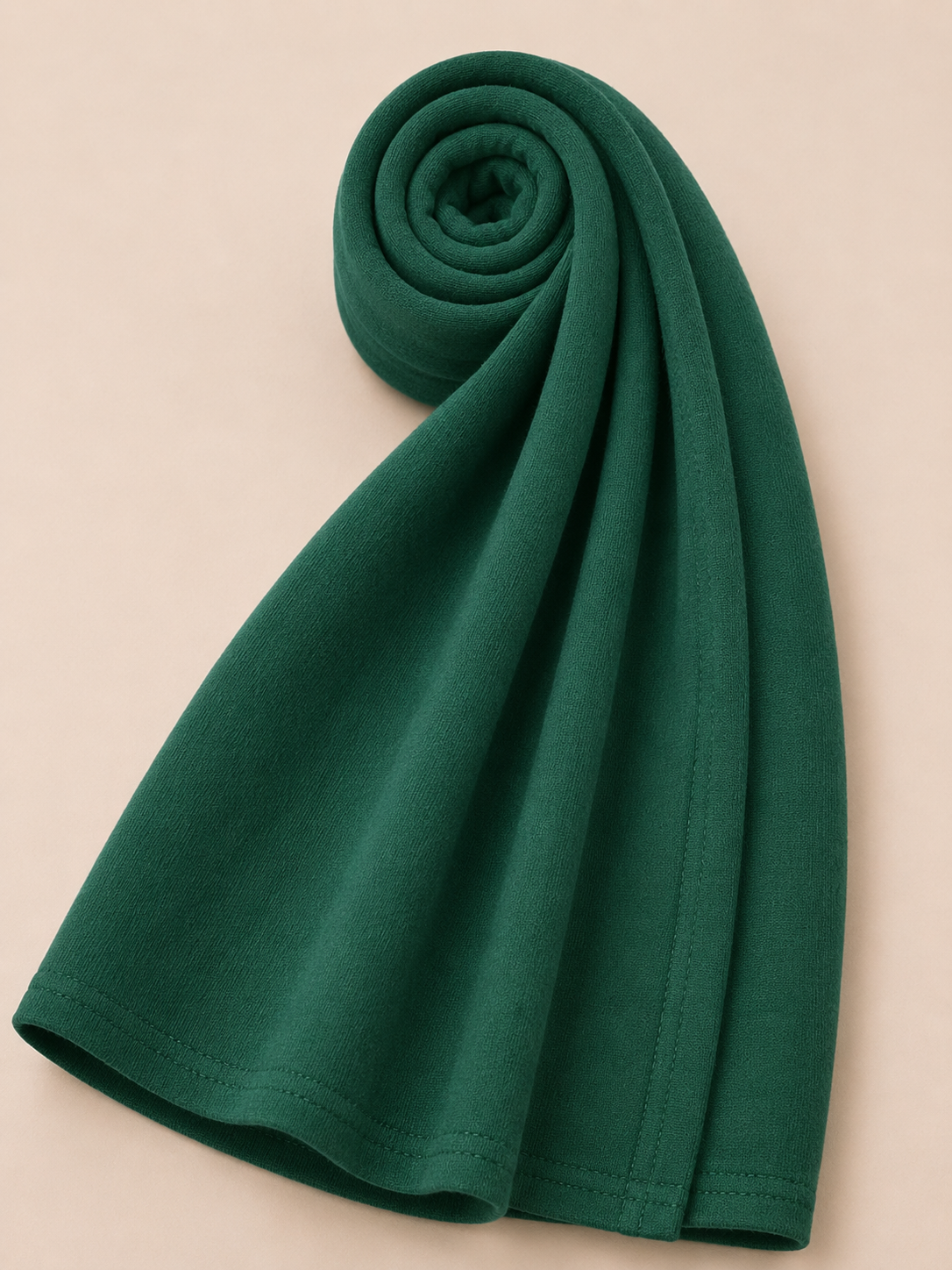 Premium emerald green jersey hijab with soft stretch fabric and stitched edge detailing by Simply Zida
