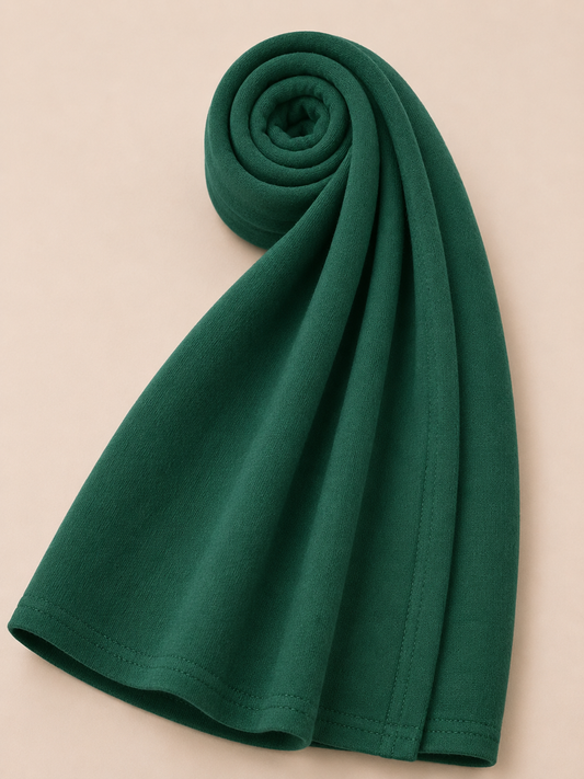 Premium emerald green jersey hijab with soft stretch fabric and stitched edge detailing by Simply Zida