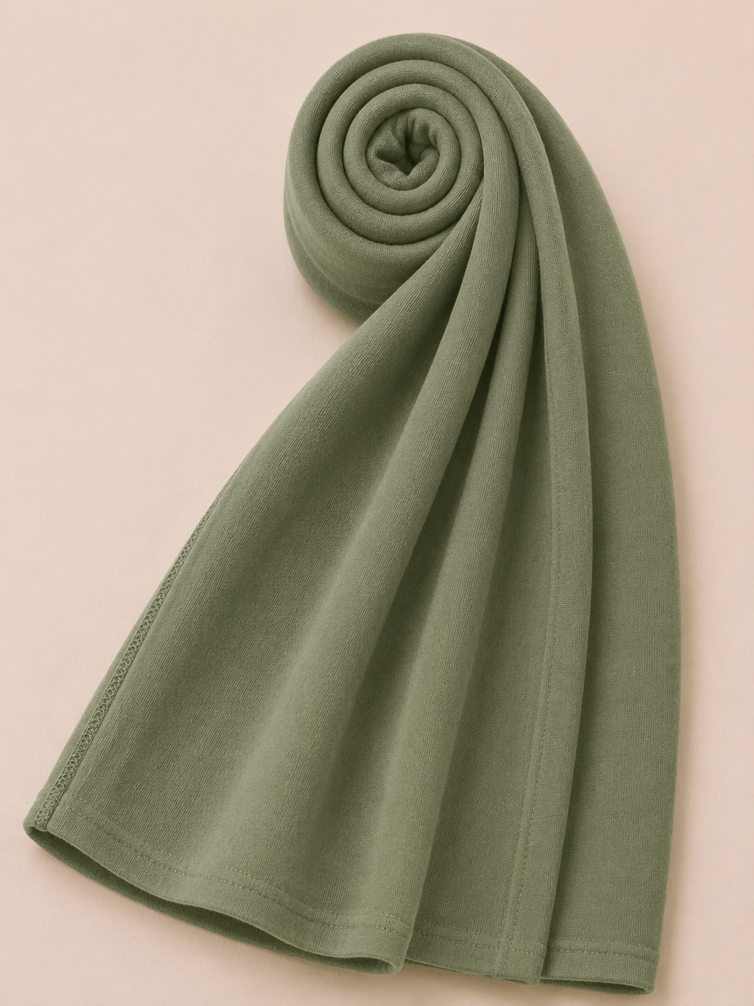 Premium sage green jersey hijab with soft stretch fabric and stitched edge detailing by Simply Zida