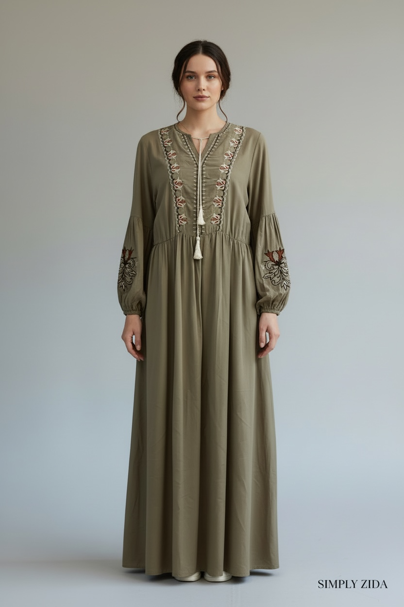 Front view of olive modest dress with tassel detail

