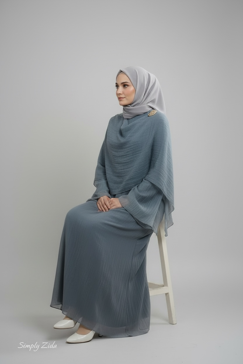 Frosty blue two piece modest abaya set with soft draped overlay and matching hijab