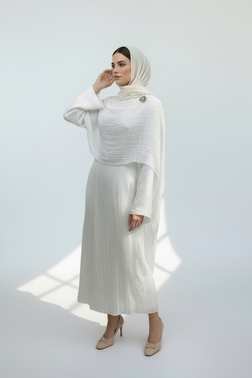 Elegant white modest abaya with layered draped overlay and flared sleeves